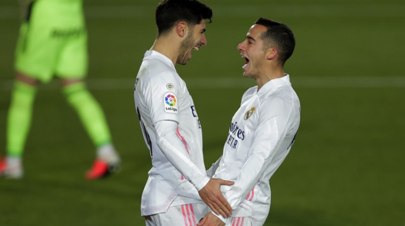 Marko Asensio un Lukass Vaskess. Foto: AP/Scanpix